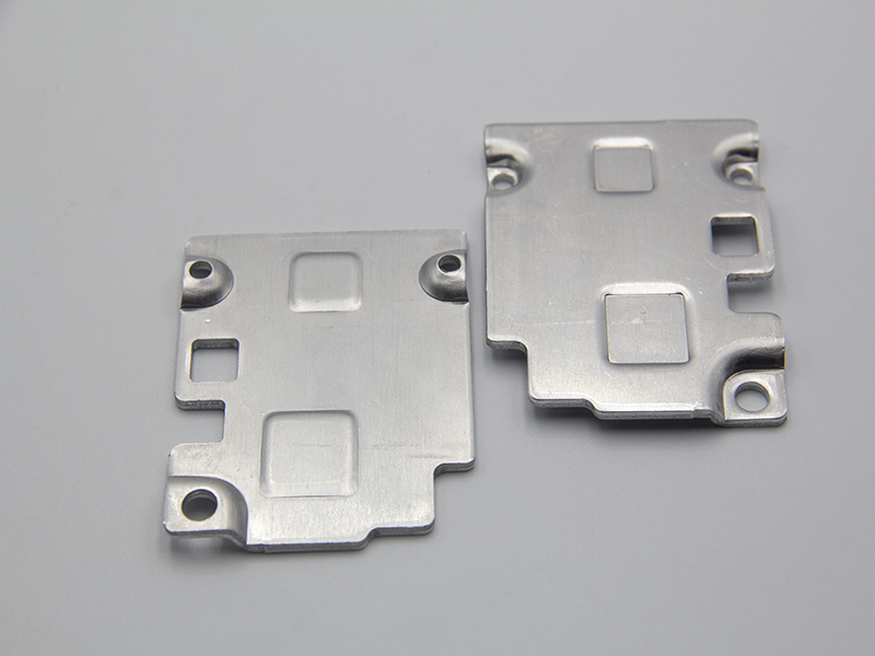 屏蔽罩冲压保证平整度的方法